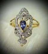 Feminine 14K Yellow Gold Ring with Pear Shaped Tanzanite
