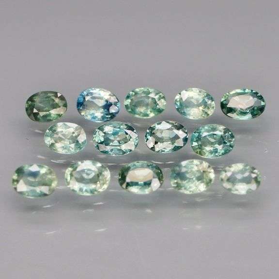 Exotic 2.13ct 14pc single vein blue green Sapphire set