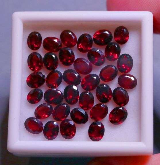 Amazing 14.16ct oval cut cherry red Garnet set