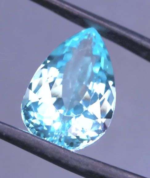 Absolutely stunning 15.05ct pear cut vibrant Swiss blue Topaz