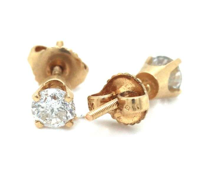 One pair of 14kt yellow gold round brilliant cut diamond stud earrings
