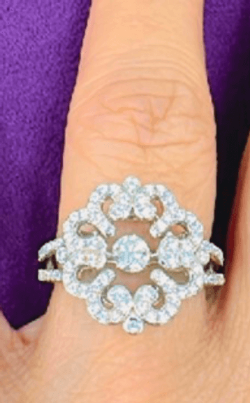 Beautiful Flower style Sterling silver with center dancing simulated diamond Ring in size 7