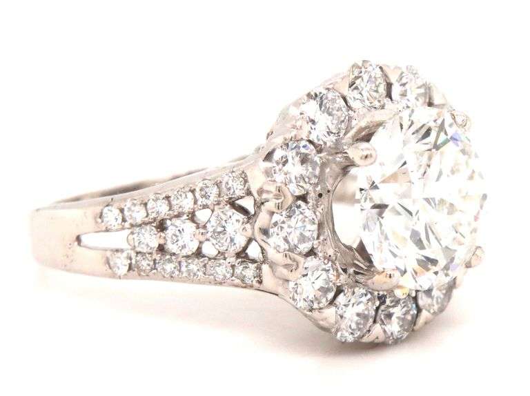 18kt White gold 3.04ct round brilliant cut lab grown diamond in natural diamond halo setting