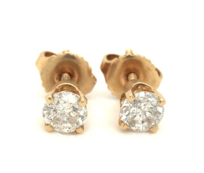 One pair of 14kt yellow gold round brilliant cut diamond stud earrings