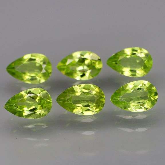 Dazzling 5.68ct untreated apple green Peridot set