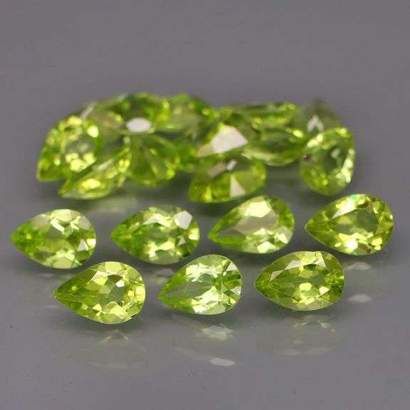 Dazzling 8.60ct untreated apple green Peridot set