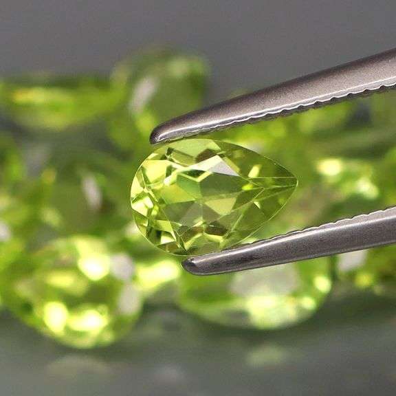 Dazzling 8.60ct untreated apple green Peridot set
