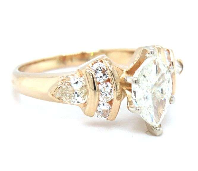 14kt Yellow gold 1ctw marquise and 0.60ctw PS and round side engagement ring