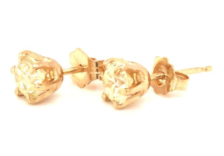 One pair of 14kt yellow gold 1.03ctw round brilliant cut diamond stud earrings