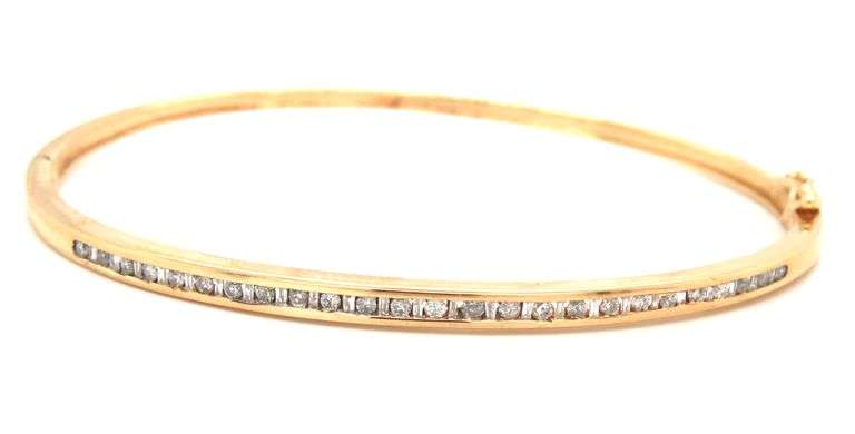 10kt Yellow gold 0.55ctw round brilliant cut and baguette bangle bracelet