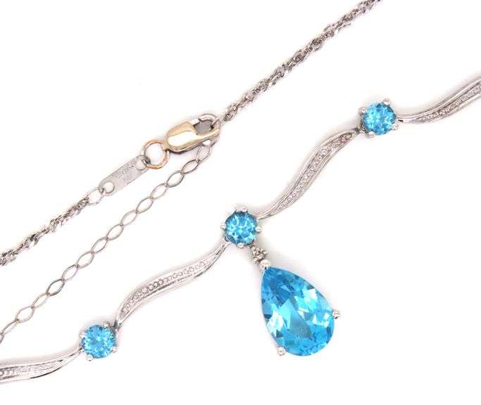 10kt White gold round and pear shaped blue topaz station V necklace