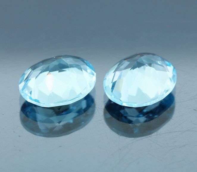 Huge! 12x10mm pair of swiss blue Topaz weighing 9.10 carats!
