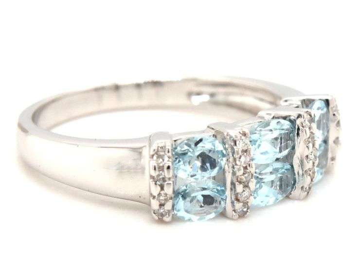14kt White gold blue topaz and diamond ring