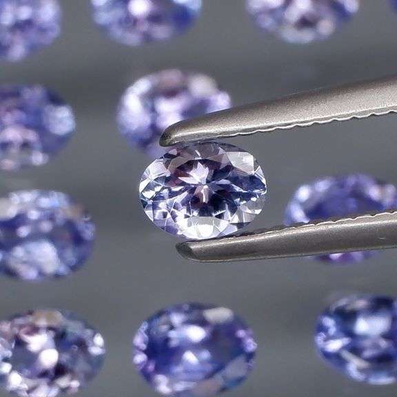 Heavy flashing 2.90ct oval cut Tanzanite set