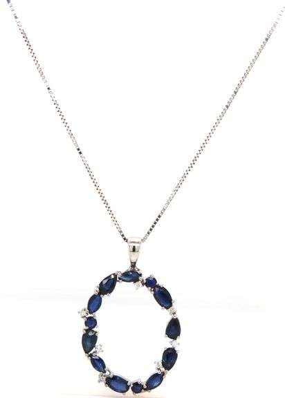 14kt White gold blue sapphire and diamond pendant on chain