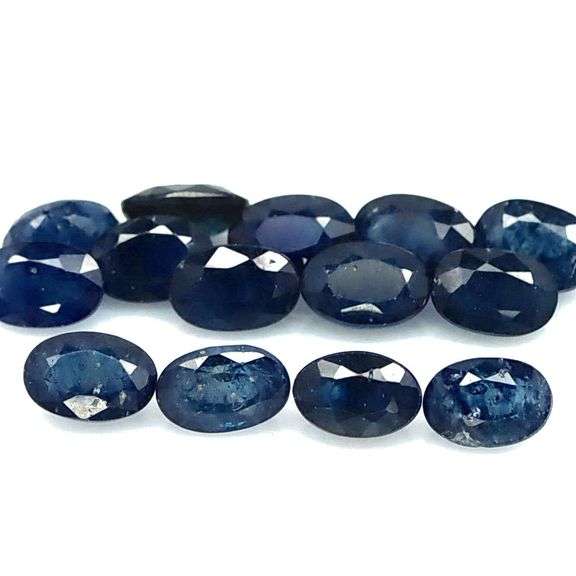 Beautifully colored 10.78ct ink blue Sapphire set