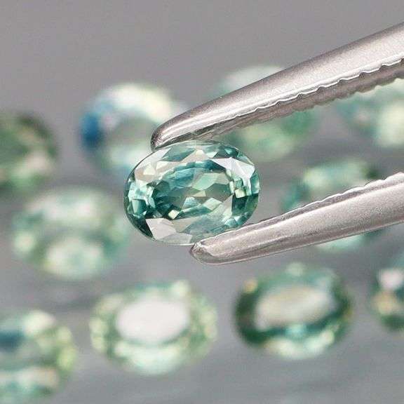 Exotic 2.13ct 14pc single vein blue green Sapphire set