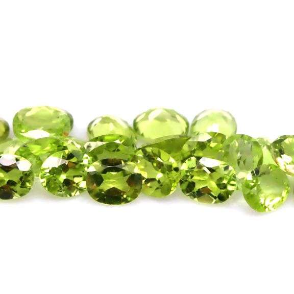 Dazzling 9.20ct untreated apple green Peridot set