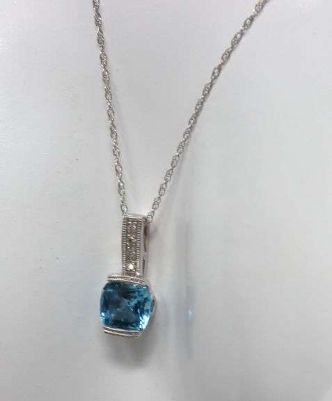 10kt White gold blue topaz and diamond pendant on chain