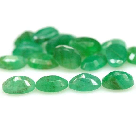 Vivid color in this 8.03ct Zambian Emerald set