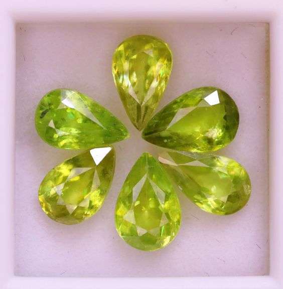 Collectors 5.67ct vivid lime green Sphene set