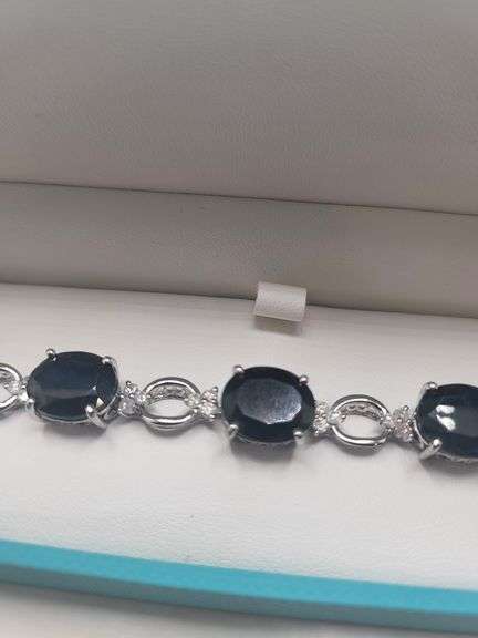 Very fine Black diamond 45.22 ctw with diamond accent set in silver ring, GGV certified
