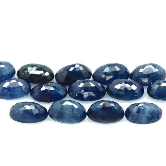 Beautifully colored 10.78ct ink blue Sapphire set