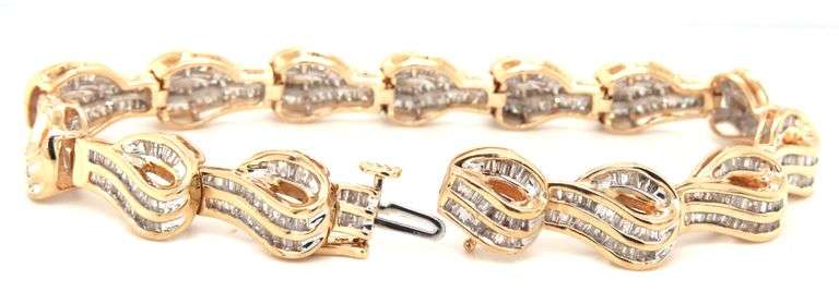 14kt Yellow gold 4.50ctw baguette diamond wave bracelet