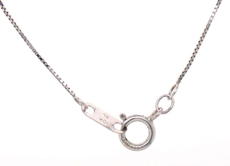 10kt White gold blue sapphire and diamond pendant on chain