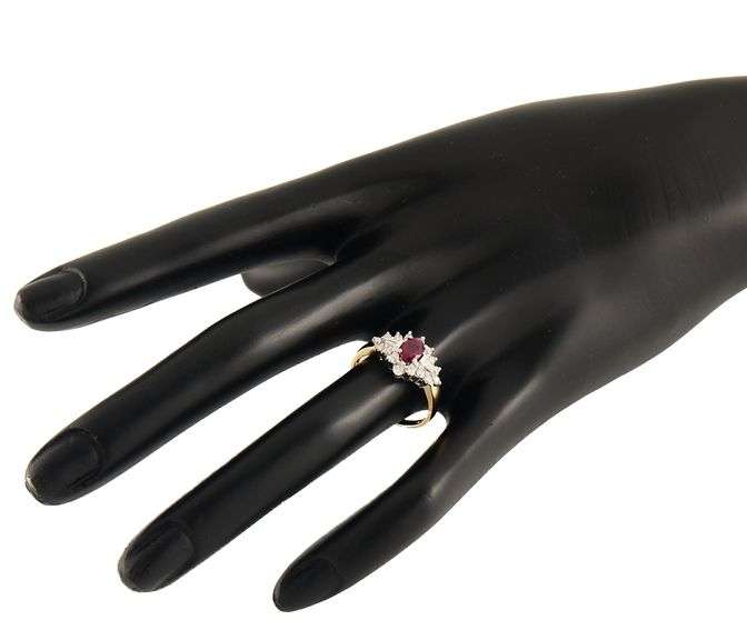 0.60ct Oval Ruby and 0.35ctw Baguette Round Diamond Starburst Frame Ring in 14K