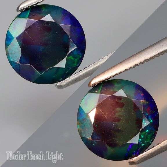 Glittering color in this 1.95ct fully faceted black Opal!