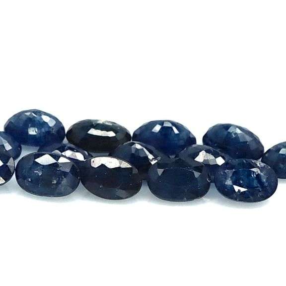 Beautifully colored 10.78ct ink blue Sapphire set