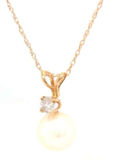 14kt Yellow gold 7mm pearl and diamond pendant on chain