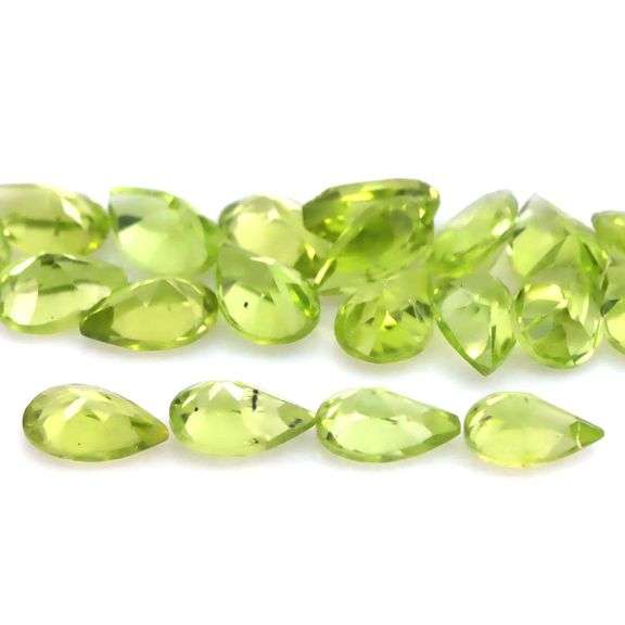 Dazzling 9.10ct untreated apple green Peridot set