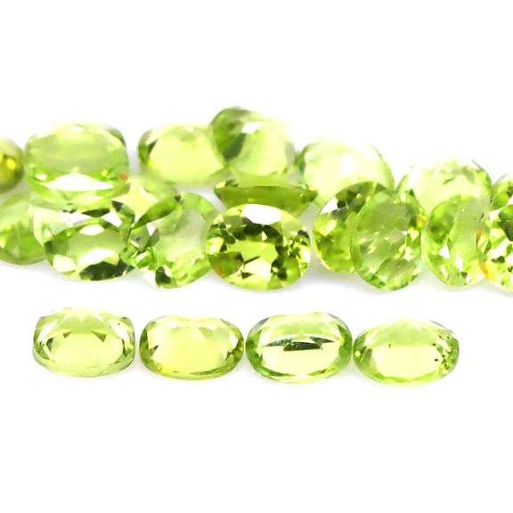 Dazzling 9.20ct untreated apple green Peridot set