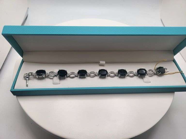 Very fine Black diamond 45.22 ctw with diamond accent set in silver ring, GGV certified