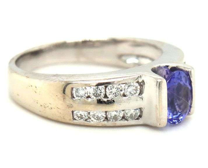 14kt White gold oval Tanzanite and 2 row channel set diamond ring
