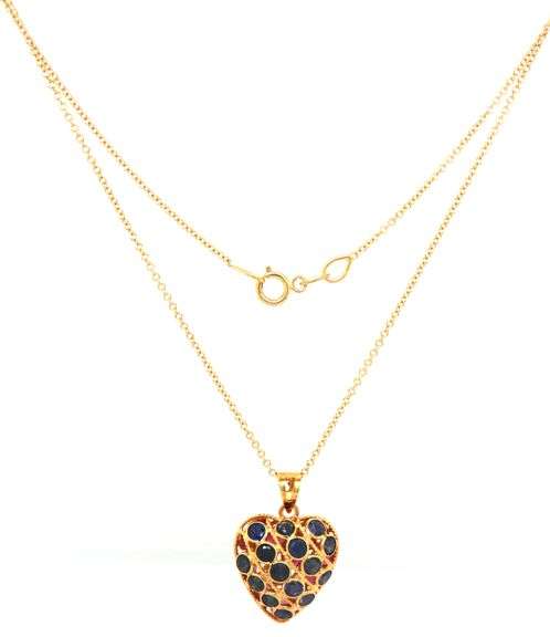 18kt Yellow gold reversible sapphire and ruby heart shaped pendant on chain