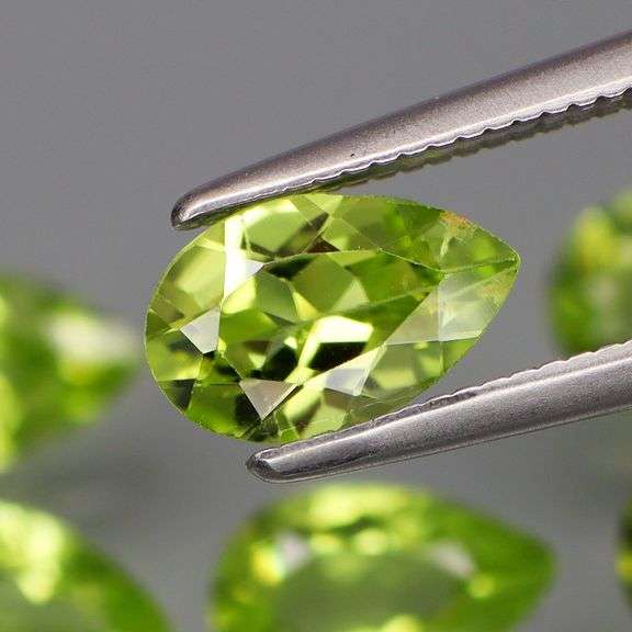 Dazzling 5.68ct untreated apple green Peridot set
