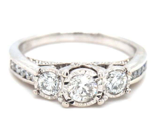 14kt White gold 0.85ctw 3 stone Illusion set engagement ring