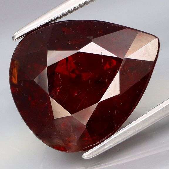 Huge! Chianti red! 12.85ct top luster Spessartite Garnet