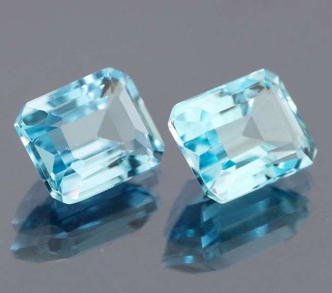 Dazzling 5.25ct vivid blue emerald cut Topaz pair