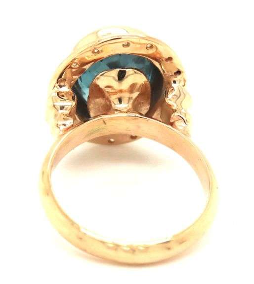 14kt Yellow gold bezel set oval blue topaz and diamond ring
