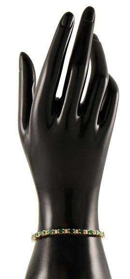 5.50ctw Oval Emerald and 0.65ctw Diamond Accent Tennis Bracelet in 14K