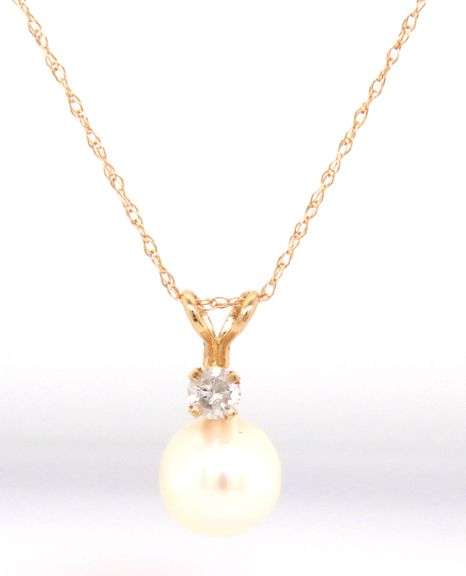 14kt Yellow gold 7mm pearl and diamond pendant on chain