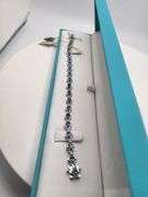 A true statement of elegance of Tanzanite and diamond Bracelet in Silver – GGA Certified. Set in lus