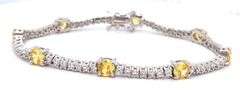 Round brilliant yellow and white cubic zirconia tennis bracelet in 925 sterling silver
