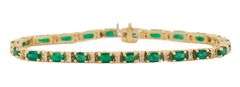 5.50ctw Oval Emerald and 0.65ctw Diamond Accent Tennis Bracelet in 14K
