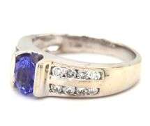 14kt White gold oval Tanzanite and 2 row channel set diamond ring