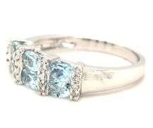 14kt White gold blue topaz and diamond ring